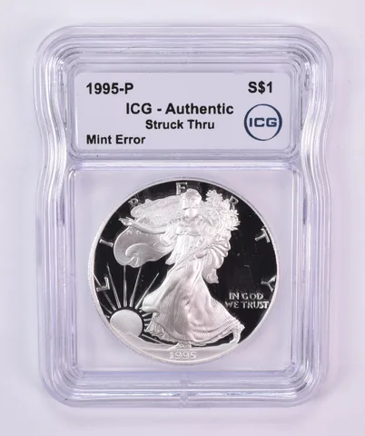 1995-P American Silver Eagle Mint Error Struck Thru Authentic ICG