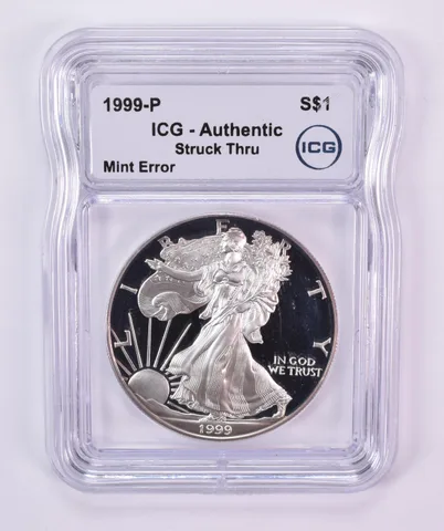 1999-P American Silver Eagle Mint Error Struck Thru Authentic ICG