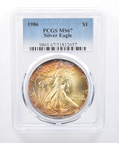 1986 American Silver Eagle MS67 PCGS Yellow Tone *8286