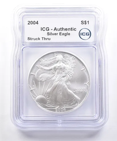 ERROR 2004 American Silver Eagle Struck Thru ICG a2357