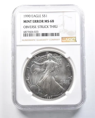 1990 American Silver Eagle Mint Error Obverse Struck Thru MS68 NGC *8225