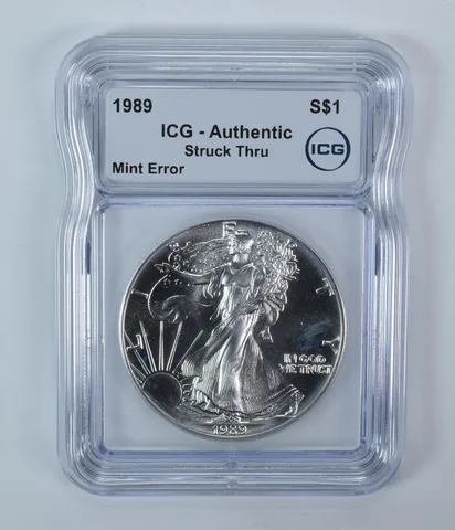 1989 American Silver Eagle Mint Error Struck Thru Authentic ICG