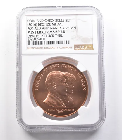(2016) Bronze Medal Reagan Coin Chronicles Mint Error Struck Thru MS69 NGC *1950
