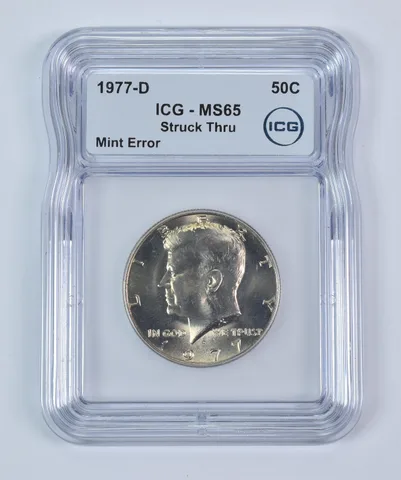 1977-D Kennedy Half Dollar Mint Error Struck Thru MS65 ICG a9343