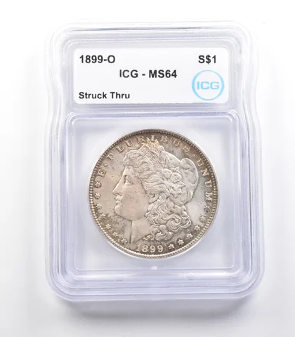 1899-O Morgan Silver Dollar Mint Error Struck Thru MS64 ICG *2427