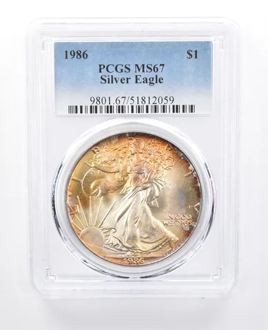 1986 American Silver Eagle MS67 PCGS Yellow Tone *8180