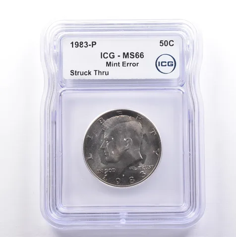 1983-P Kennedy Half Dollar Mint Error Struck Thru MS66 ICG *9070
