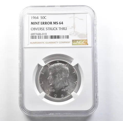1964 Kennedy Half Dollar Mint Error Obverse Struck Thru MS64 NGC *3117