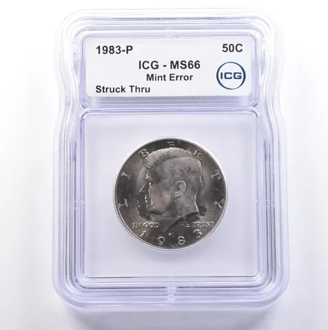 1983-P Kennedy Half Dollar Mint Error Struck Thru MS66 ICG *9069