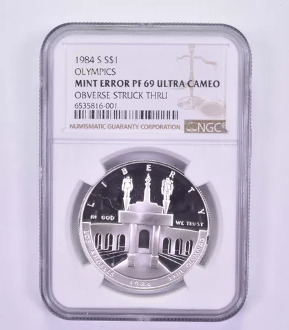 Mint Error PF69 UCAM 1984-S Los Angeles Olympics - OBV Struck Thru - NGC *9609