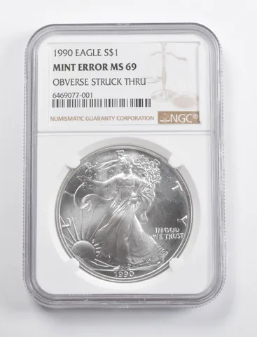 Mint Error MS69 1990 American Silver Eagle OBV Struck Thru NGC a3458