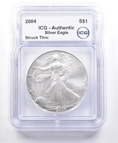 ERROR 2004 American Silver Eagle Struck Thru ICG a2356