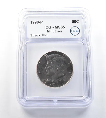 1990-P Kennedy Half Dollar Mint Error Struck Thru MS65 ICG a0683