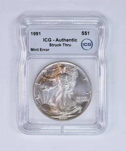 1991 American Silver Eagle Mint Error Struck Thru Authentic ICG Nice Tone *7979
