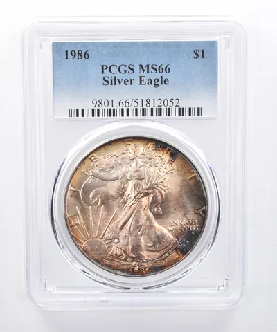 1986 American Silver Eagle MS66 PCGS Yellow Tone *8495