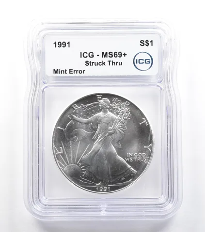 1991 American Silver Eagle Mint Error Struck Thru MS69+ ICG *5559