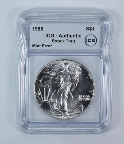 1988 American Silver Eagle Mint Error Struck Thru Authentic ICG