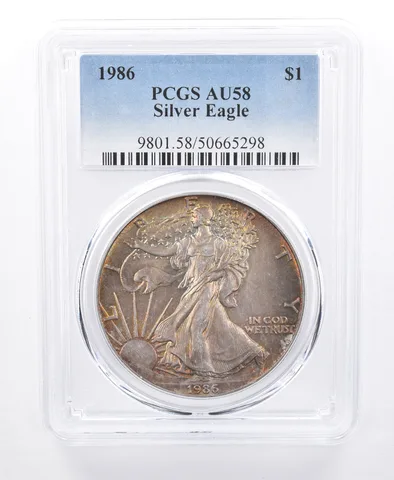 1986 American Silver Eagle AU58 PCGS Yellow/Green Tone *8613