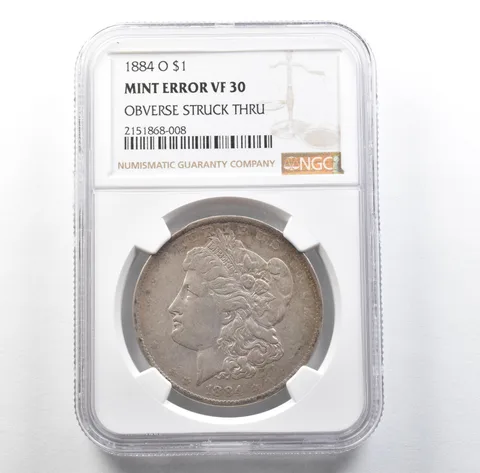 1884-O Morgan Silver Dollar Mint Error Obverse Struck Thru VF30 NGC *3180