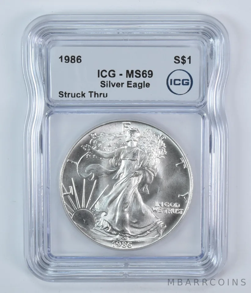 1986 American Silver Eagle Mint Error Struck Thru MS69 ICG