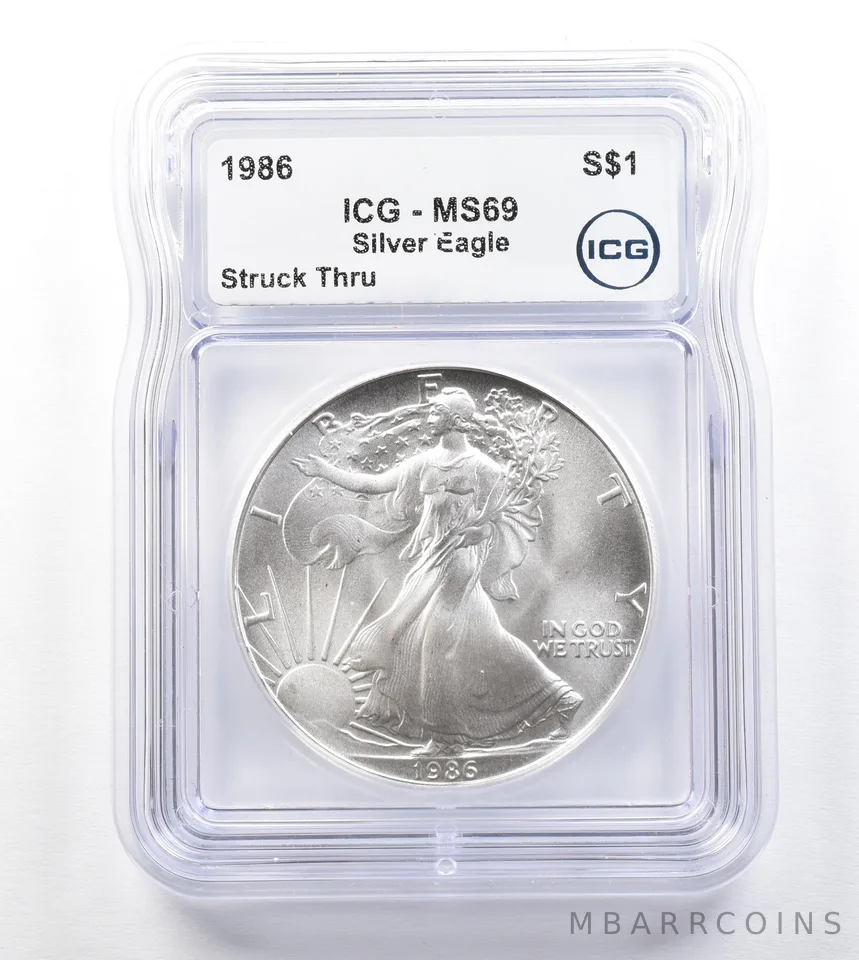 1986 American Silver Eagle Mint Error Struck Thru MS69 ICG a3293