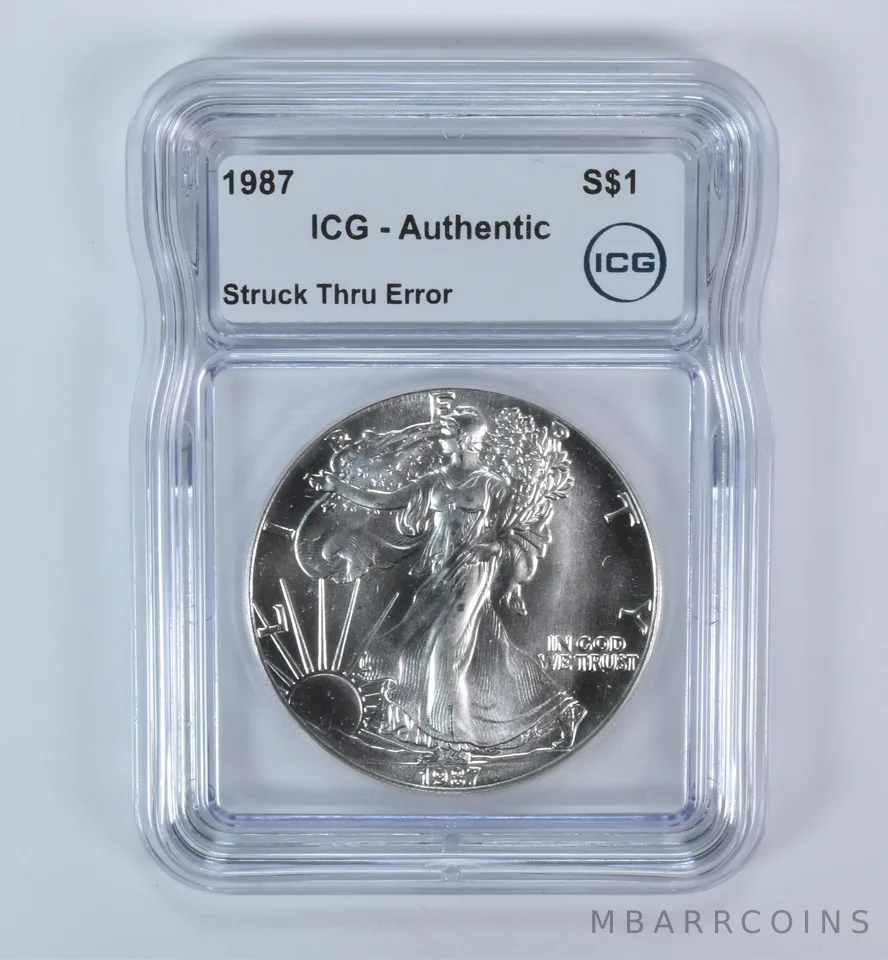 1987 American Silver Eagle Mint Error Struck Thru Authentic ICG