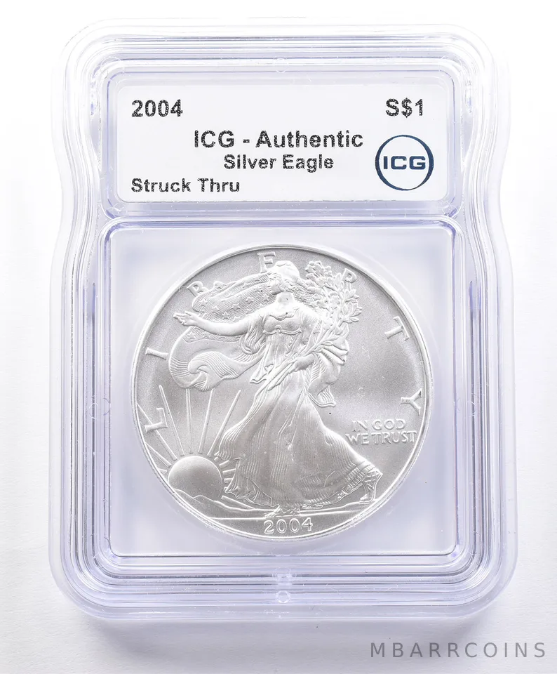 ERROR 2004 American Silver Eagle Struck Thru ICG a2357