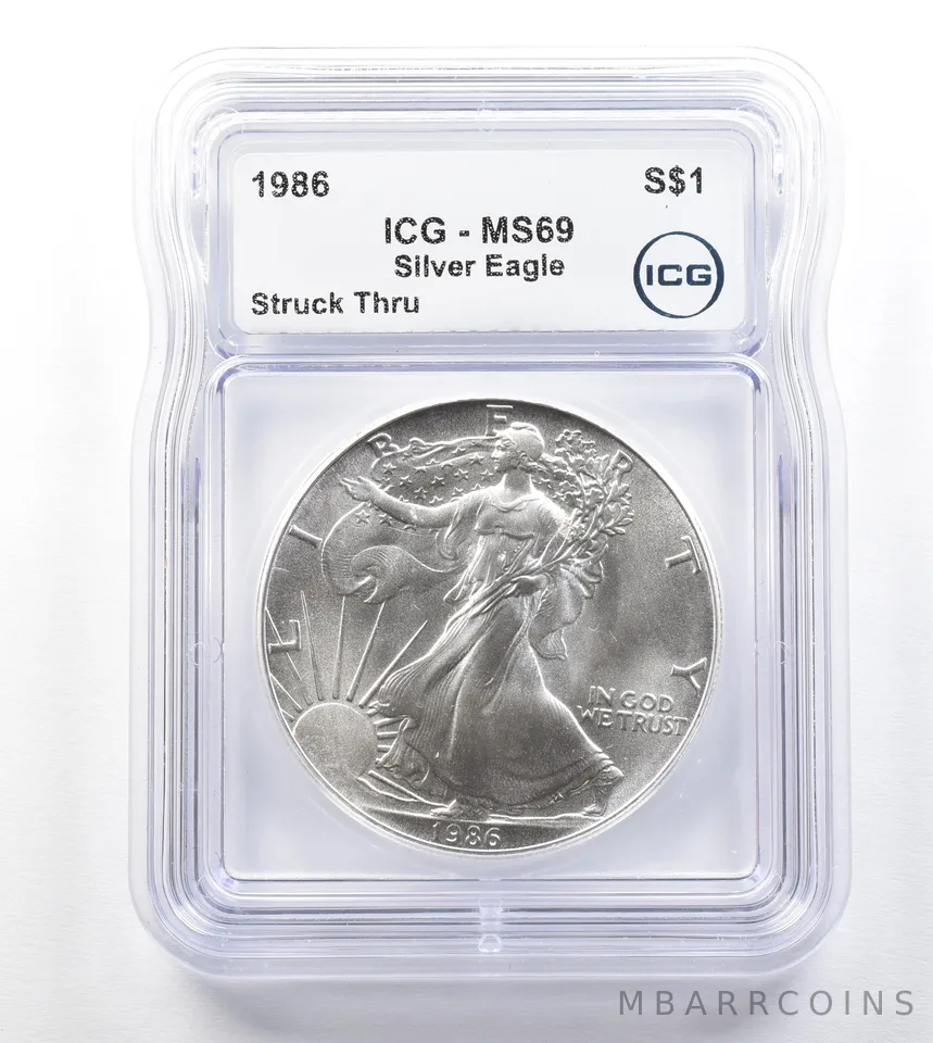1986 American Silver Eagle Mint Error Struck Thru MS69 ICG a3295