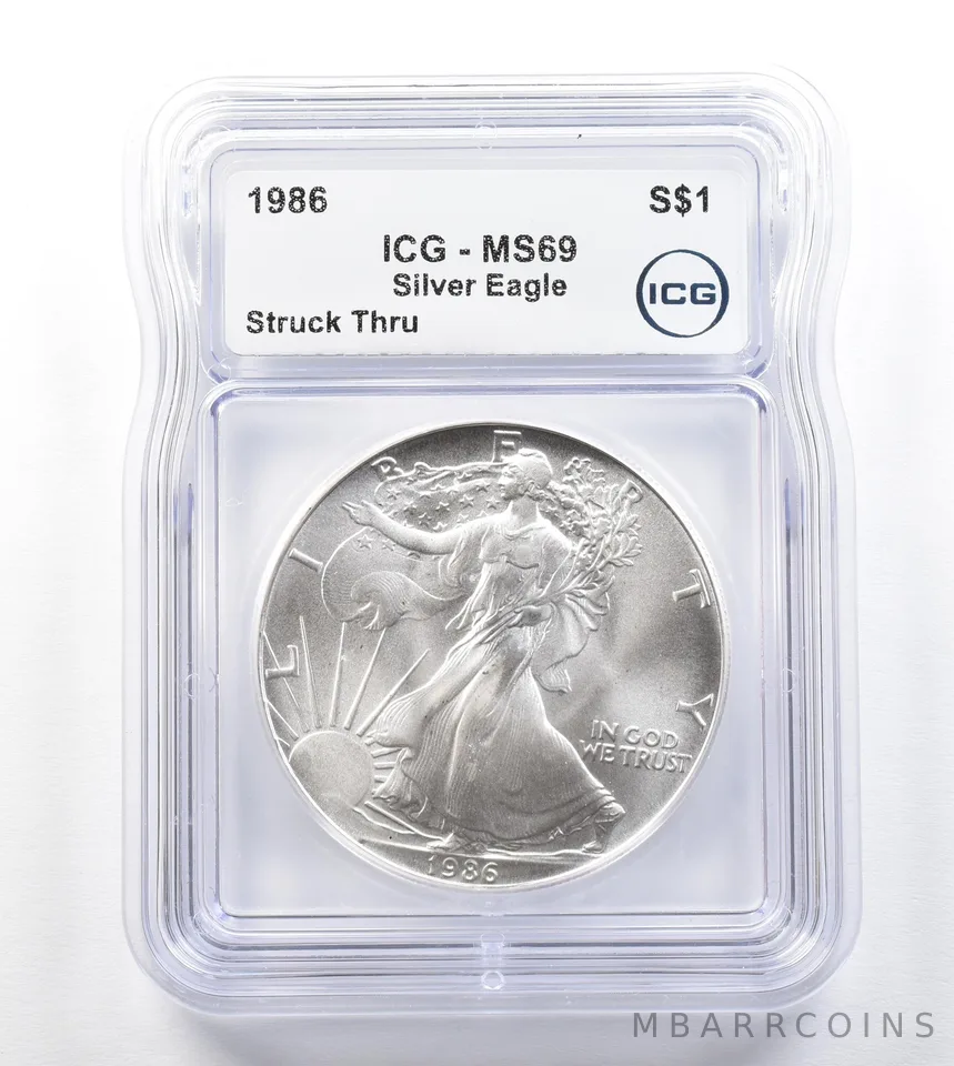 1986 American Silver Eagle Mint Error Struck Thru MS69 ICG a3296