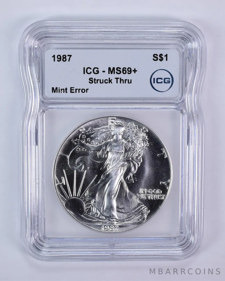 1987 American Silver Eagle Mint Error Struck Thru MS69+ ICG