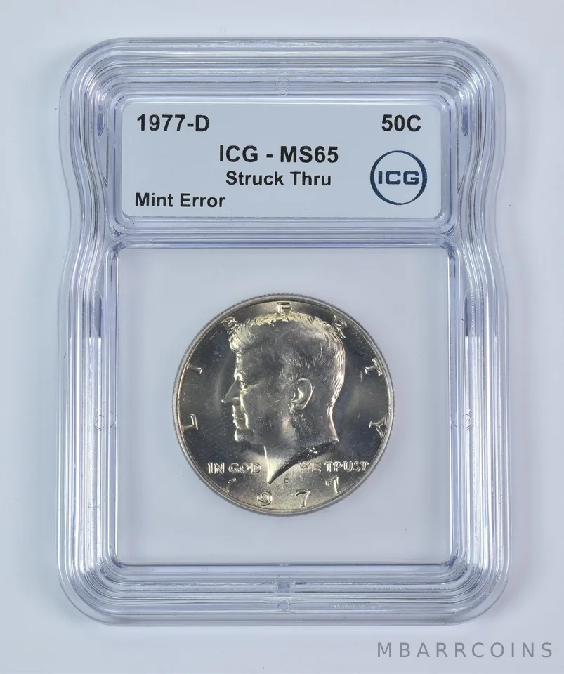 1977-D Kennedy Half Dollar Mint Error Struck Thru MS65 ICG a9343