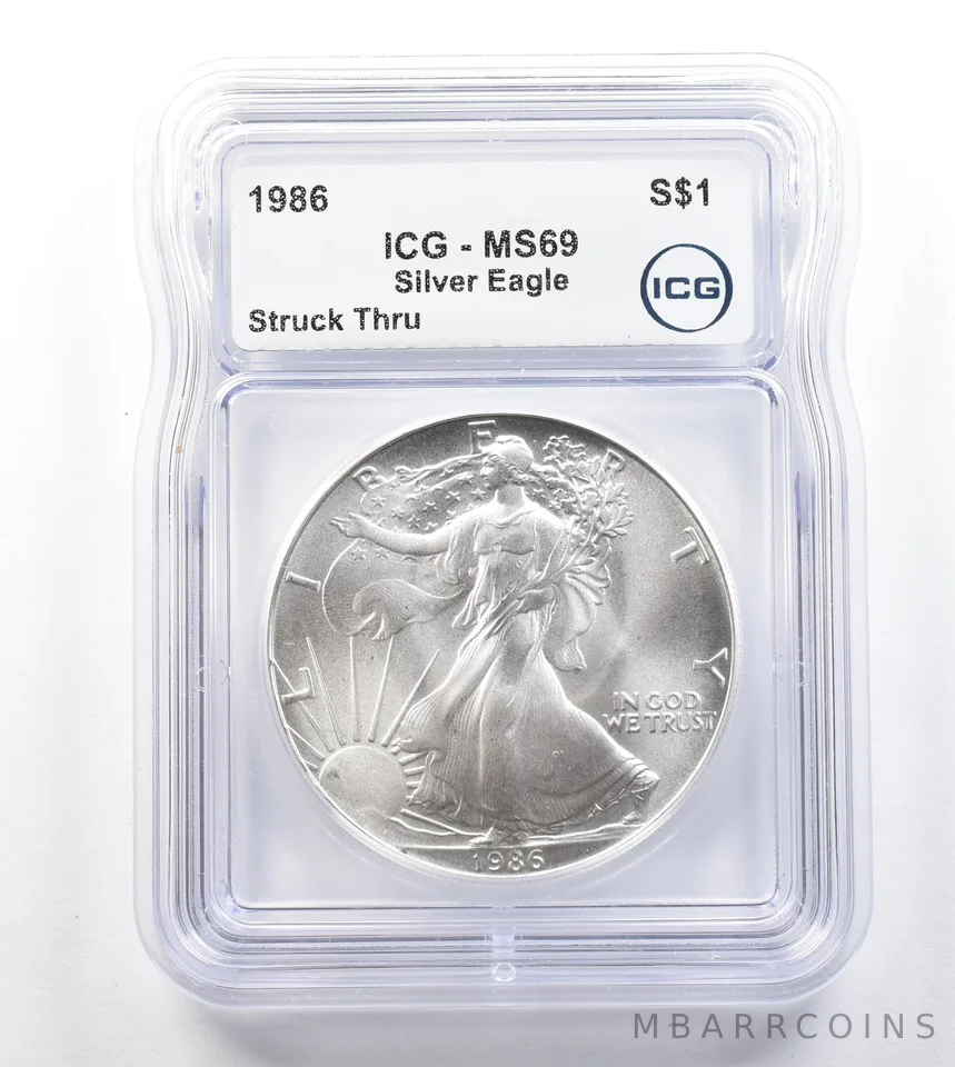 1986 American Silver Eagle Mint Error Struck Thru MS69 ICG *3290