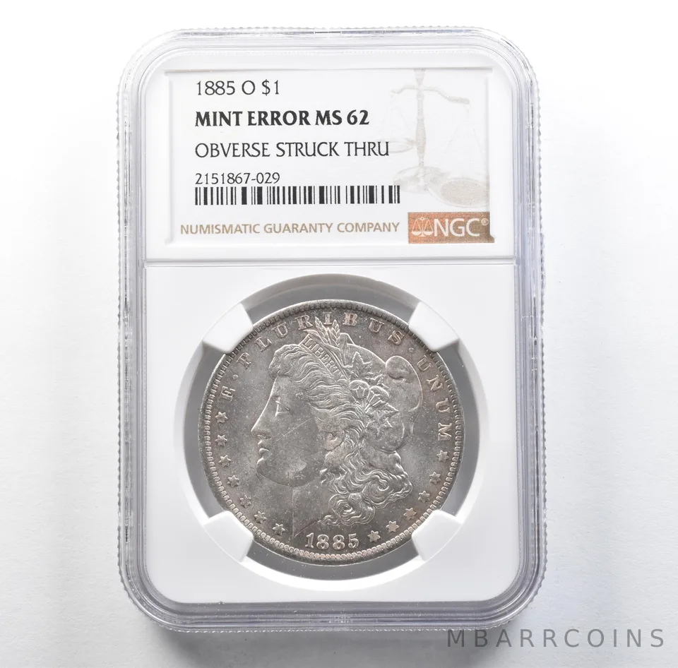 1885-O Morgan Silver Dollar Mint Error Obverse Struck Thru MS62 NGC *3147