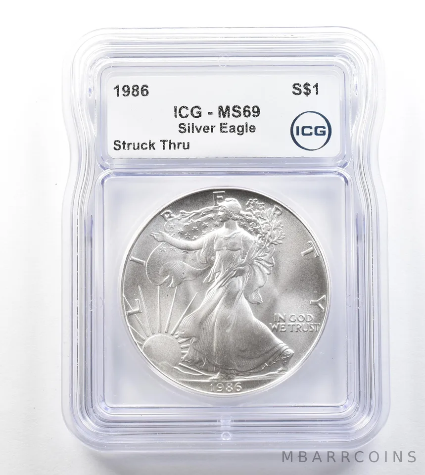 1986 American Silver Eagle Mint Error Struck Thru MS69 ICG *3291