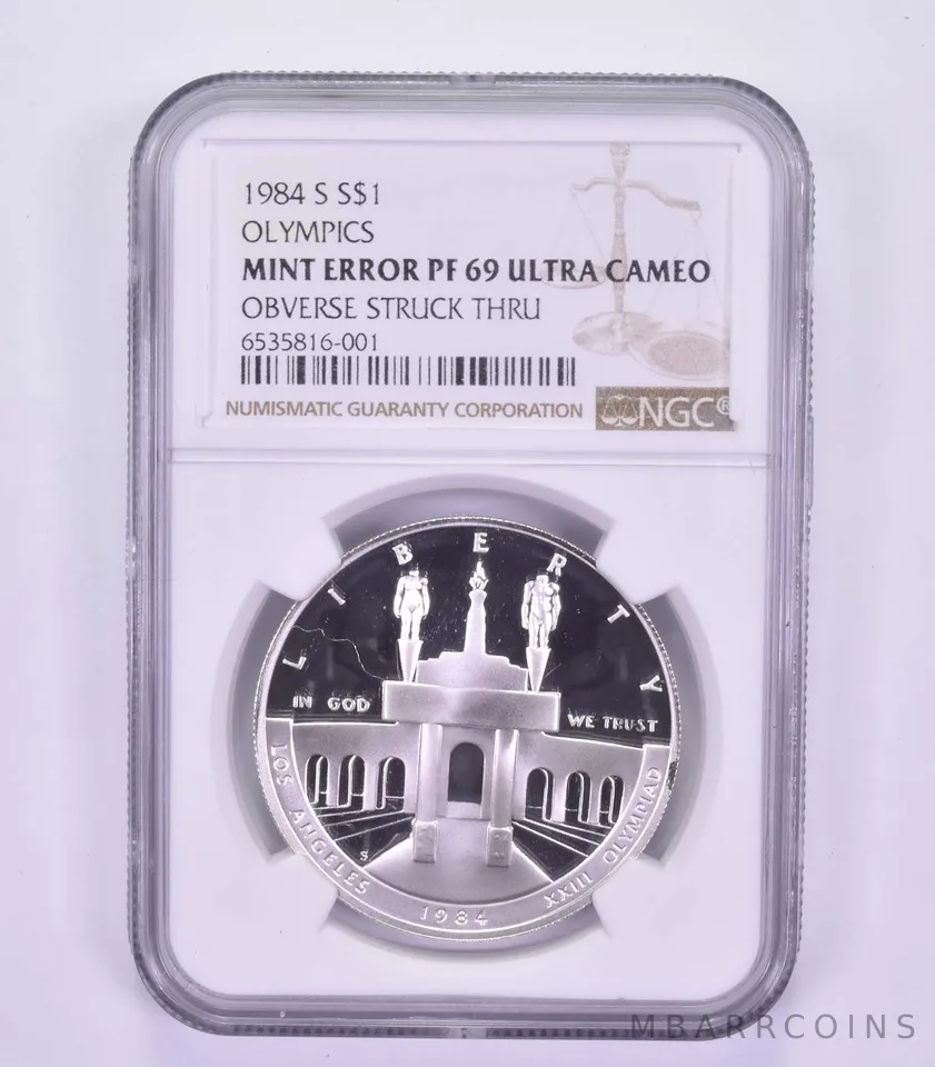 Mint Error PF69 UCAM 1984-S Los Angeles Olympics - OBV Struck Thru - NGC *9609