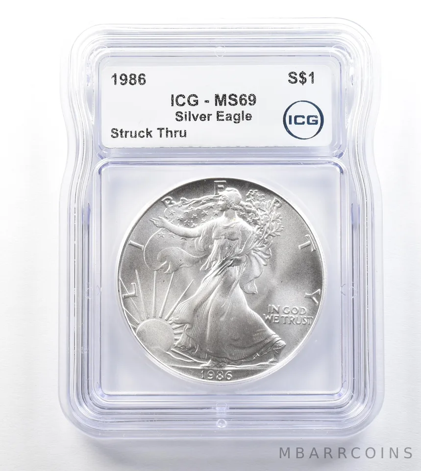 1986 American Silver Eagle Mint Error Struck Thru MS69 ICG *3297
