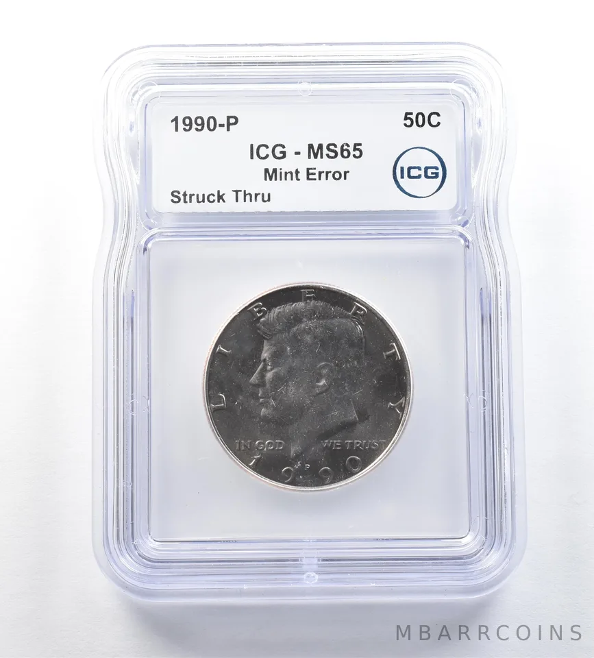 1990-P Kennedy Half Dollar Mint Error Struck Thru MS65 ICG a0683
