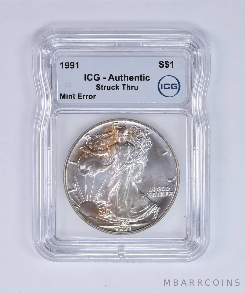 1991 American Silver Eagle Mint Error Struck Thru Authentic ICG Nice Tone *7979