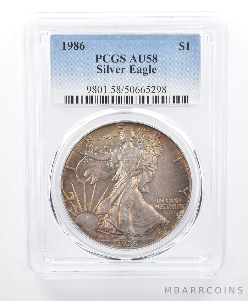 1986 American Silver Eagle AU58 PCGS Yellow/Green Tone *8613