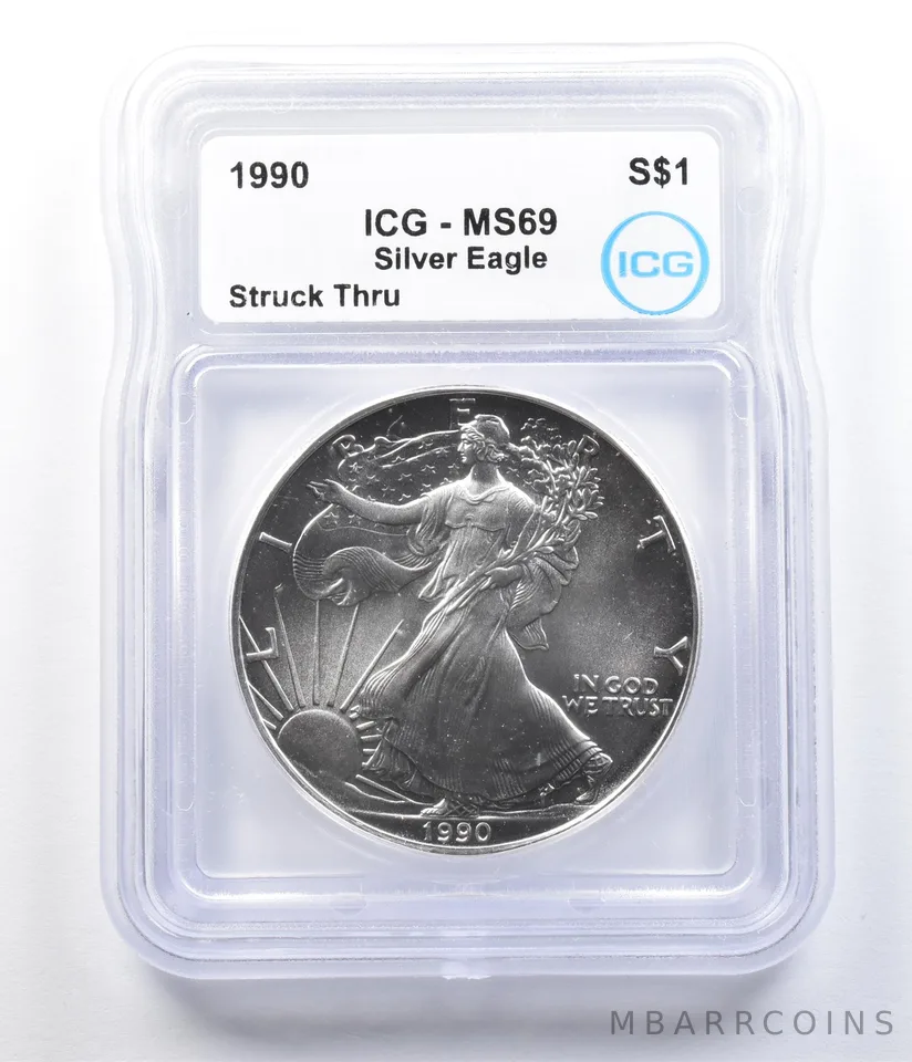 1990 American Silver Eagle Mint Error Struck Thru MS69 ICG *1081
