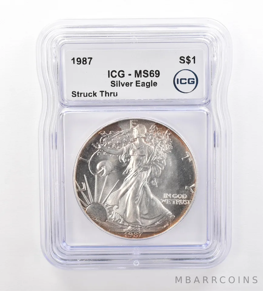 1987 American Silver Eagle Mint Error Struck Thru MS69 ICG Peripheral Tone *7509